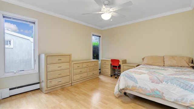 12 Hasting Dr, Stony Brook, NY 11790 - bedroom featuring light wood finished floors, ornamental molding, baseboard heating, an office area, and ceiling fan