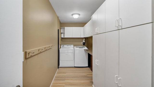 12 Hasting Dr, Stony Brook, NY 11790 - laundry room with washing machine and clothes dryer, cabinet space, and light wood-style flooring