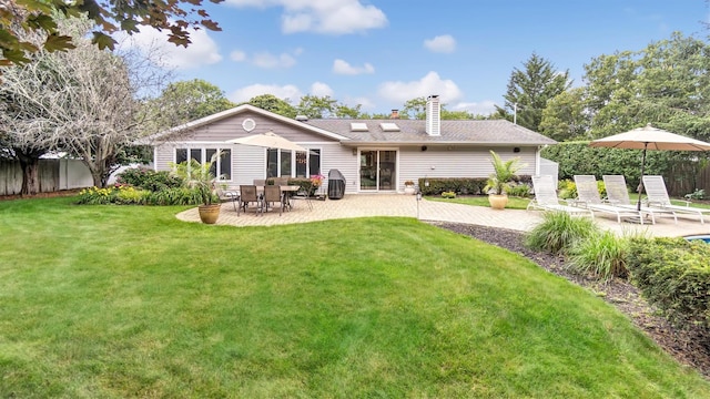 12 Hasting Dr, Stony Brook, NY 11790 - back of property featuring a chimney and a patio