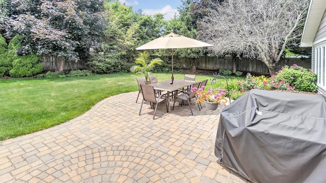 12 Hasting Dr, Stony Brook, NY 11790 - fenced backyard featuring a patio area, outdoor dining space, and area for grilling