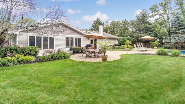 12 Hasting Dr, Stony Brook, NY 11790 - back of house with a patio area, a lawn, a chimney, and a swimming pool