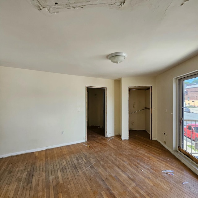 1754 Givan Ave, Bronx, NY 10469 - unfurnished bedroom featuring hardwood / wood-style floors and baseboards