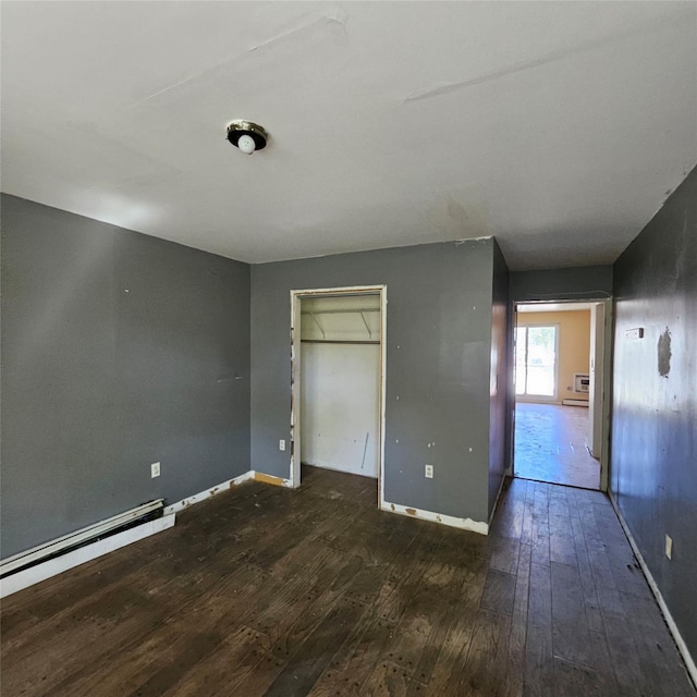 1754 Givan Ave, Bronx, NY 10469 - unfurnished bedroom featuring hardwood / wood-style floors, a closet, and baseboard heating