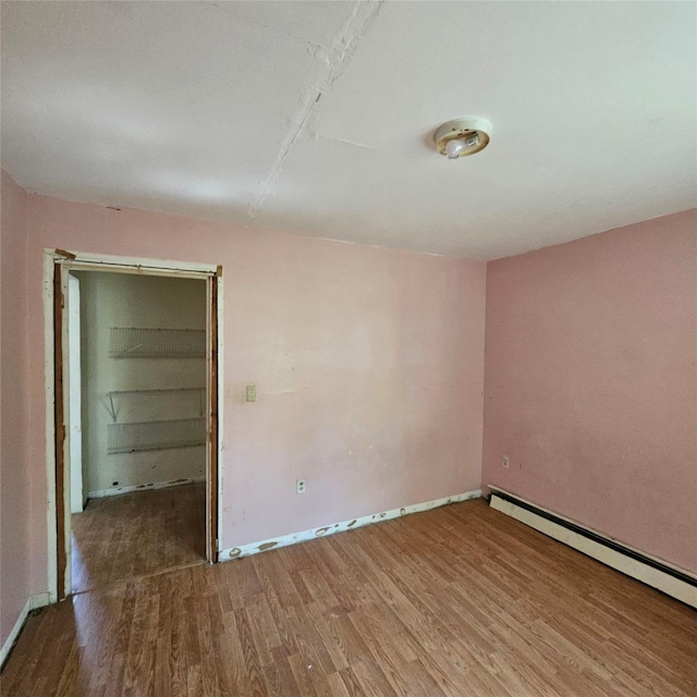 1754 Givan Ave, Bronx, NY 10469 - spare room with wood finished floors and baseboard heating