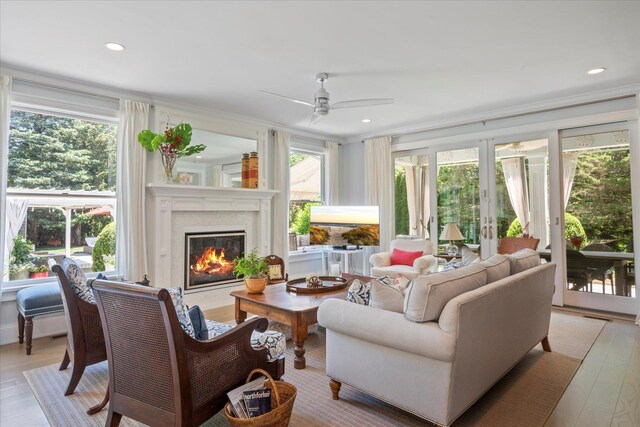 12 Terry Dr, Shelter Island, NY 11964 - living room with ceiling fan, a premium fireplace, healthy amount of natural light, light wood-style flooring, and ornamental molding