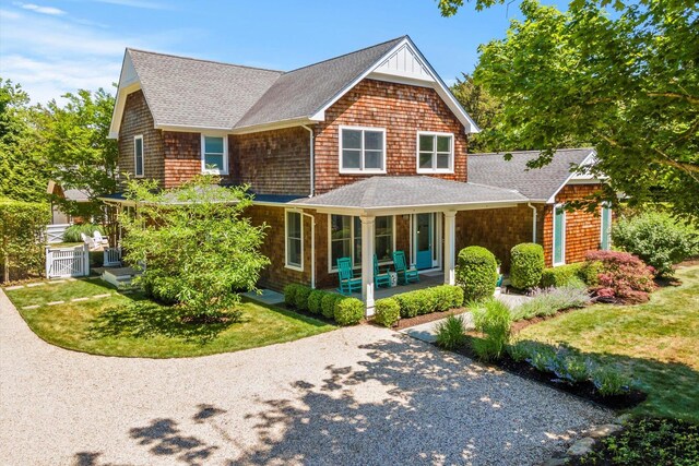12 Terry Dr, Shelter Island, NY 11964 - shingle-style home with roof with shingles and a porch