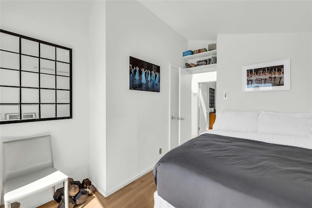 146 Ocean Walk, Fire Island Pines, NY 11782 - bedroom featuring wood finished floors and lofted ceiling