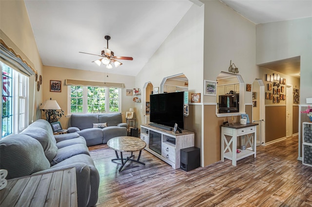 8 Glenwood Pl, Farmingville, NY 11738 - living room featuring wood finished floors, ceiling fan, arched walkways, and high vaulted ceiling