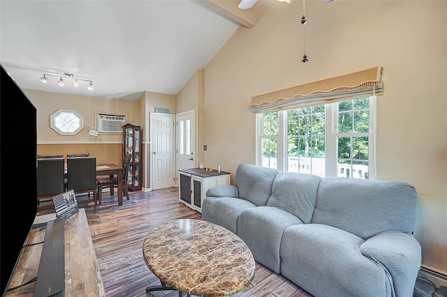 8 Glenwood Pl, Farmingville, NY 11738 - living area featuring wood finished floors, a wall mounted air conditioner, beam ceiling, ceiling fan, and high vaulted ceiling