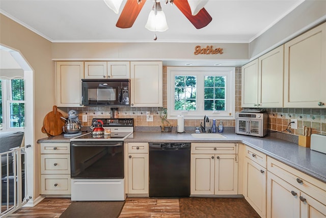 8 Glenwood Pl, Farmingville, NY 11738 - kitchen featuring black appliances, cream cabinets, dark wood finished floors, and ornamental molding
