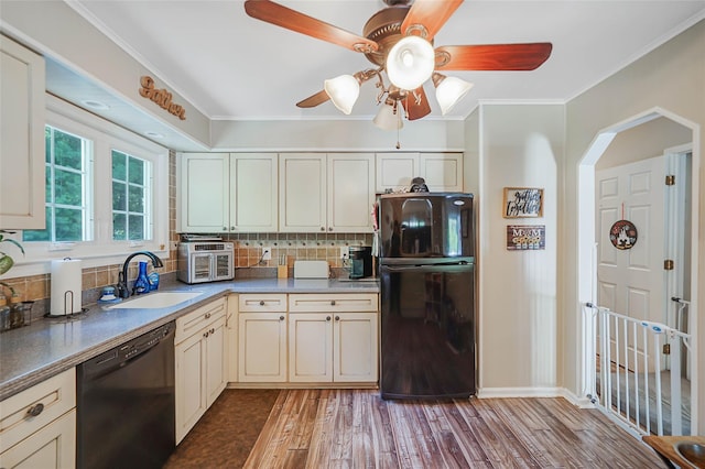 8 Glenwood Pl, Farmingville, NY 11738 - kitchen with black appliances, ceiling fan, backsplash, wood finished floors, and crown molding