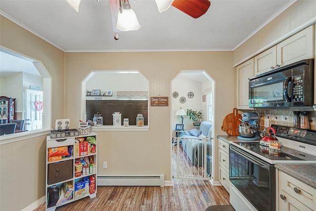 8 Glenwood Pl, Farmingville, NY 11738 - kitchen with black microwave, electric range, a baseboard heating unit, light wood finished floors, and a ceiling fan