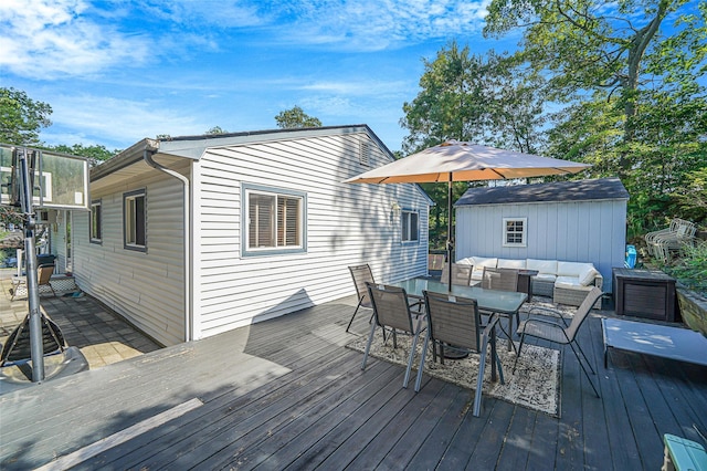 8 Glenwood Pl, Farmingville, NY 11738 - wooden terrace featuring outdoor dining area, an outdoor living space, and a storage shed