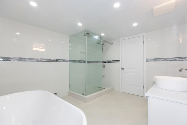 5 Bellingham Ln, Great Neck, NY 11023 - full bath with a shower stall, a soaking tub, recessed lighting, vanity, and tile walls