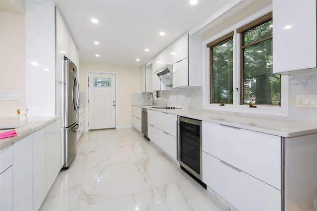 5 Bellingham Ln, Great Neck, NY 11023 - kitchen featuring beverage cooler, modern cabinets, stainless steel appliances, plenty of natural light, and recessed lighting