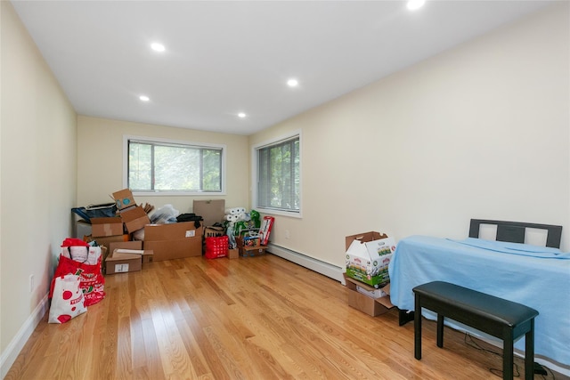 5 Bellingham Ln, Great Neck, NY 11023 - game room featuring a baseboard heating unit, wood finished floors, and recessed lighting