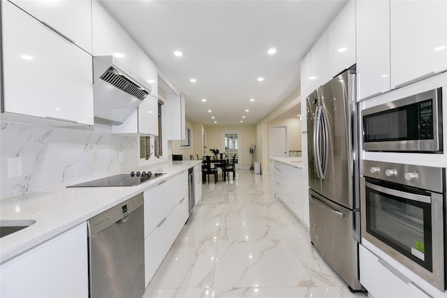 5 Bellingham Ln, Great Neck, NY 11023 - kitchen with stainless steel appliances, modern cabinets, white cabinetry, custom range hood, and recessed lighting