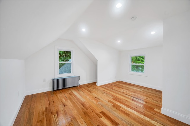17 Pinetree Dr, Shirley, NY 11967 - bonus room with radiator, light wood finished floors, lofted ceiling, and recessed lighting