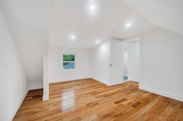 17 Pinetree Dr, Shirley, NY 11967 - additional living space with light wood-style floors, vaulted ceiling, and recessed lighting