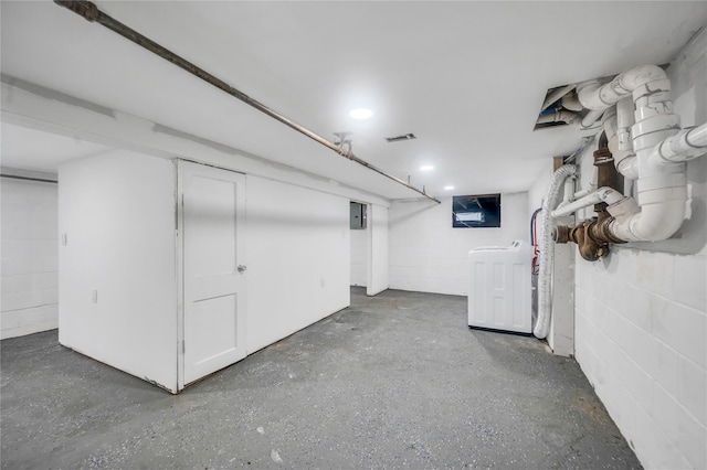 17 Pinetree Dr, Shirley, NY 11967 - finished below grade area with concrete block wall, electric panel, and washer / dryer