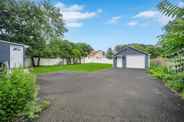 17 Pinetree Dr, Shirley, NY 11967 - view of yard with a garage, an outbuilding, and driveway