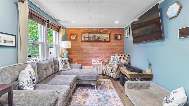 27 Lidge Dr, Farmingville, NY 11738 - living area with wood finished floors, recessed lighting, and brick wall