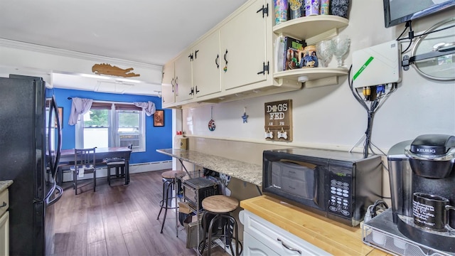 27 Lidge Dr, Farmingville, NY 11738 - kitchen featuring black appliances, dark wood-style floors, light countertops, open shelves, and white cabinets