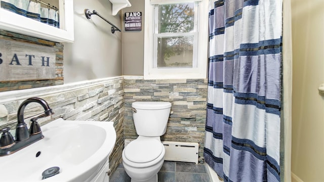 27 Lidge Dr, Farmingville, NY 11738 - full bath featuring baseboard heating, tile walls, a wainscoted wall, and curtained shower