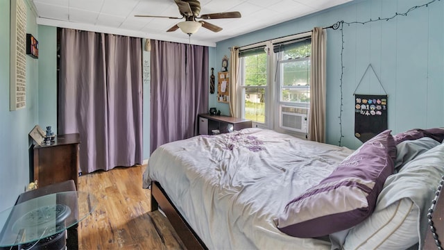 27 Lidge Dr, Farmingville, NY 11738 - bedroom with wood finished floors, cooling unit, and a ceiling fan