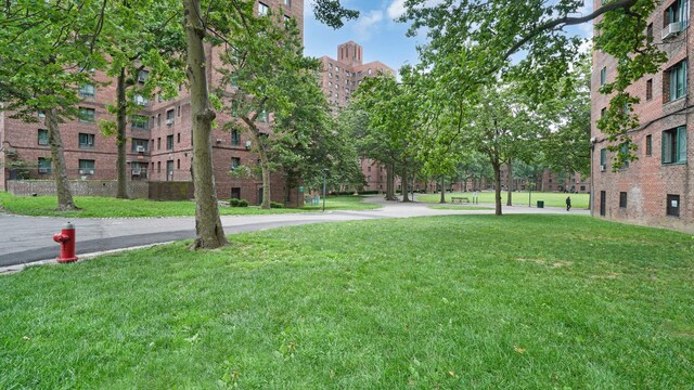 1610 Metropolitan Ave Unit 6H, Bronx, NY 10462 - surrounding community featuring a yard