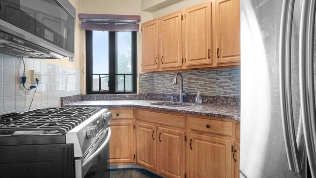 1610 Metropolitan Ave Unit 6H, Bronx, NY 10462 - kitchen with stainless steel appliances, backsplash, and dark stone counters
