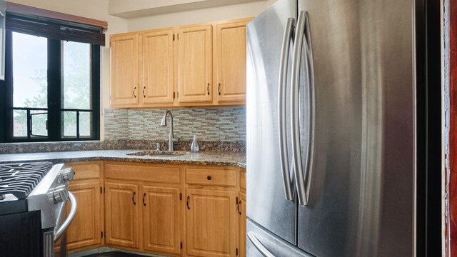 1610 Metropolitan Ave Unit 6H, Bronx, NY 10462 - kitchen featuring stainless steel appliances, light brown cabinets, backsplash, and dark stone countertops