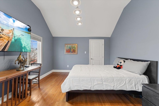 1136 W Broadway, Hewlett, NY 11557 - bedroom featuring vaulted ceiling and wood finished floors