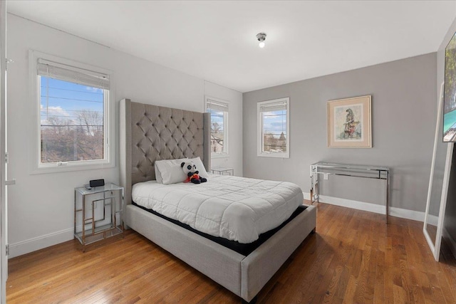 1136 W Broadway, Hewlett, NY 11557 - bedroom featuring wood finished floors and multiple windows
