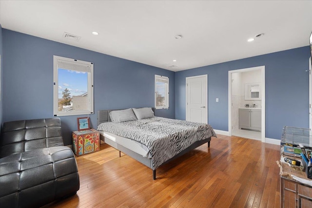 1136 W Broadway, Hewlett, NY 11557 - bedroom with hardwood / wood-style floors and recessed lighting