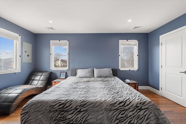 1136 W Broadway, Hewlett, NY 11557 - bedroom with electric panel, wood finished floors, and recessed lighting