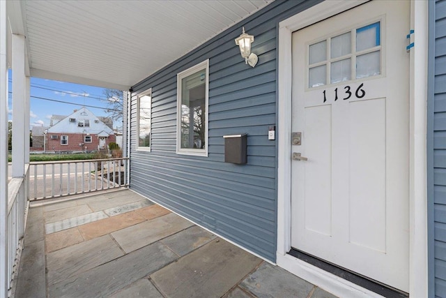 1136 W Broadway, Hewlett, NY 11557 - view of exterior entry with a porch