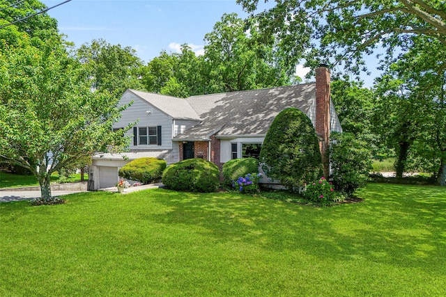 918 Sylvan Ln, Mamaroneck, NY 10543 - view of front of house with a garage, a front lawn, concrete driveway, and a chimney