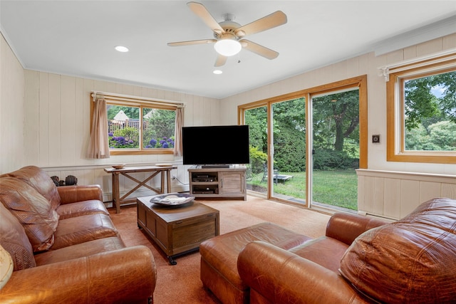 918 Sylvan Ln, Mamaroneck, NY 10543 - living area with a ceiling fan, light colored carpet, recessed lighting, wooden walls, and a decorative wall