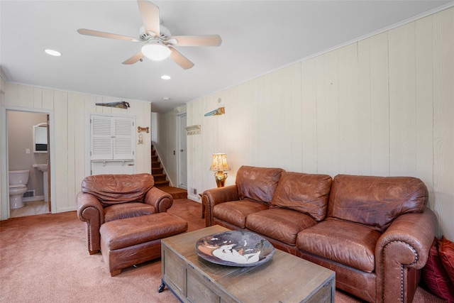 918 Sylvan Ln, Mamaroneck, NY 10543 - living room featuring a ceiling fan, light colored carpet, stairs, ornamental molding, and recessed lighting