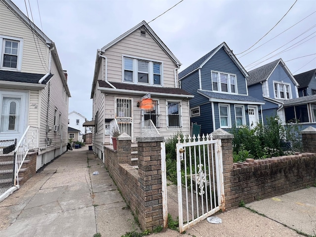 11617 141st St, Jamaica, NY 11436 - view of front of house featuring a gate and a residential view