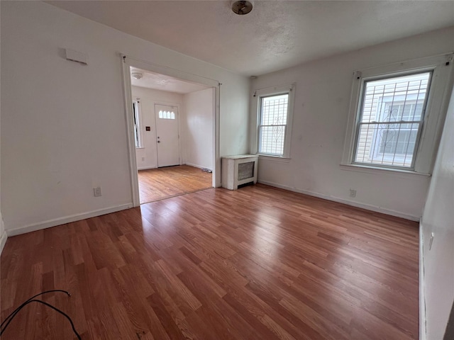11617 141st St, Jamaica, NY 11436 - unfurnished room with wood finished floors and baseboards