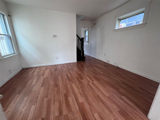 11617 141st St, Jamaica, NY 11436 - empty room featuring wood finished floors and stairway