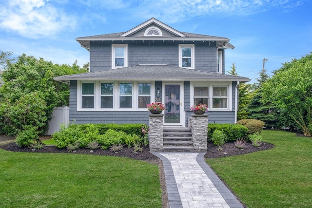 271 Foster Ave, Sayville, NY 11782 - american foursquare style home featuring a front lawn and a shingled roof