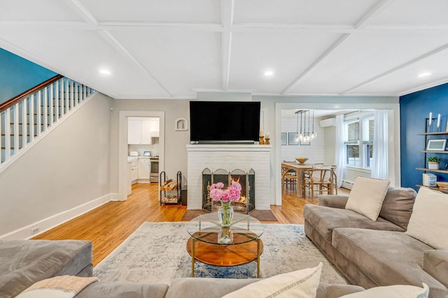 271 Foster Ave, Sayville, NY 11782 - living area with wood finished floors, stairway, a fireplace, coffered ceiling, and recessed lighting