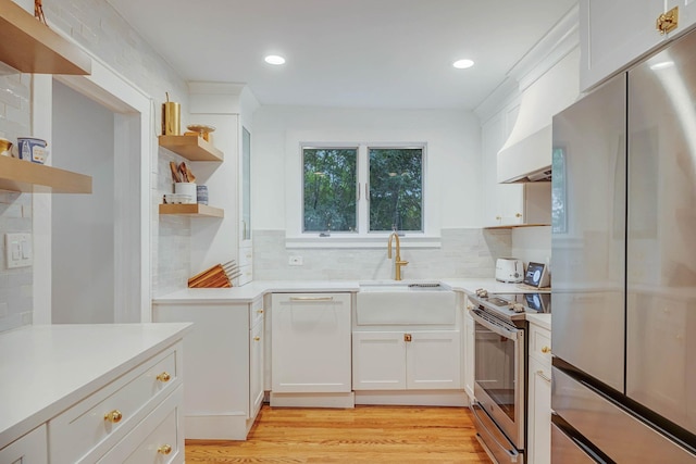 271 Foster Ave, Sayville, NY 11782 - kitchen featuring appliances with stainless steel finishes, open shelves, light countertops, white cabinets, and recessed lighting