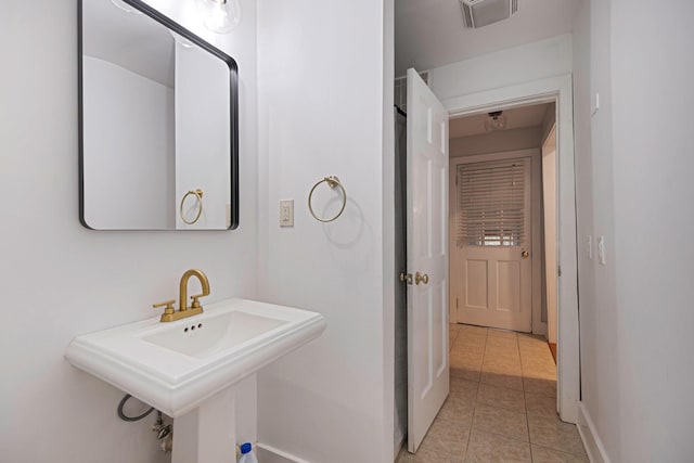 271 Foster Ave, Sayville, NY 11782 - bathroom featuring tile patterned floors and a sink
