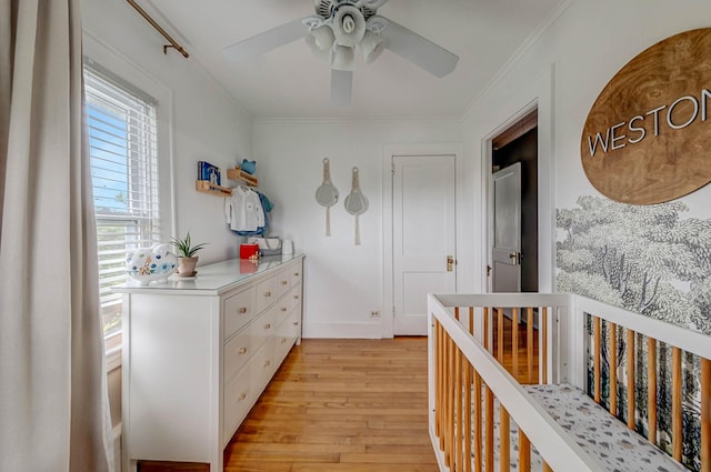 271 Foster Ave, Sayville, NY 11782 - bedroom with light wood-type flooring, a nursery area, ornamental molding, and ceiling fan