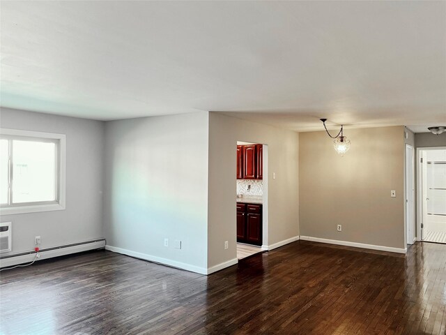 2453 Union Blvd Unit 3A, Islip, NY 11751 - unfurnished living room featuring dark wood finished floors, baseboard heating, and a chandelier