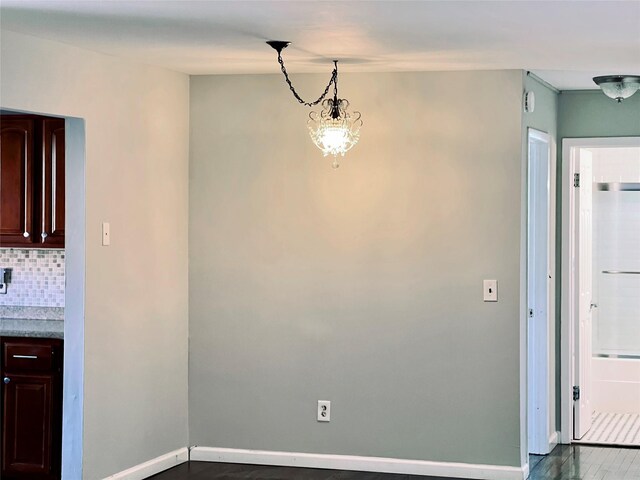 2453 Union Blvd Unit 3A, Islip, NY 11751 - unfurnished dining area featuring dark wood-style floors and a chandelier